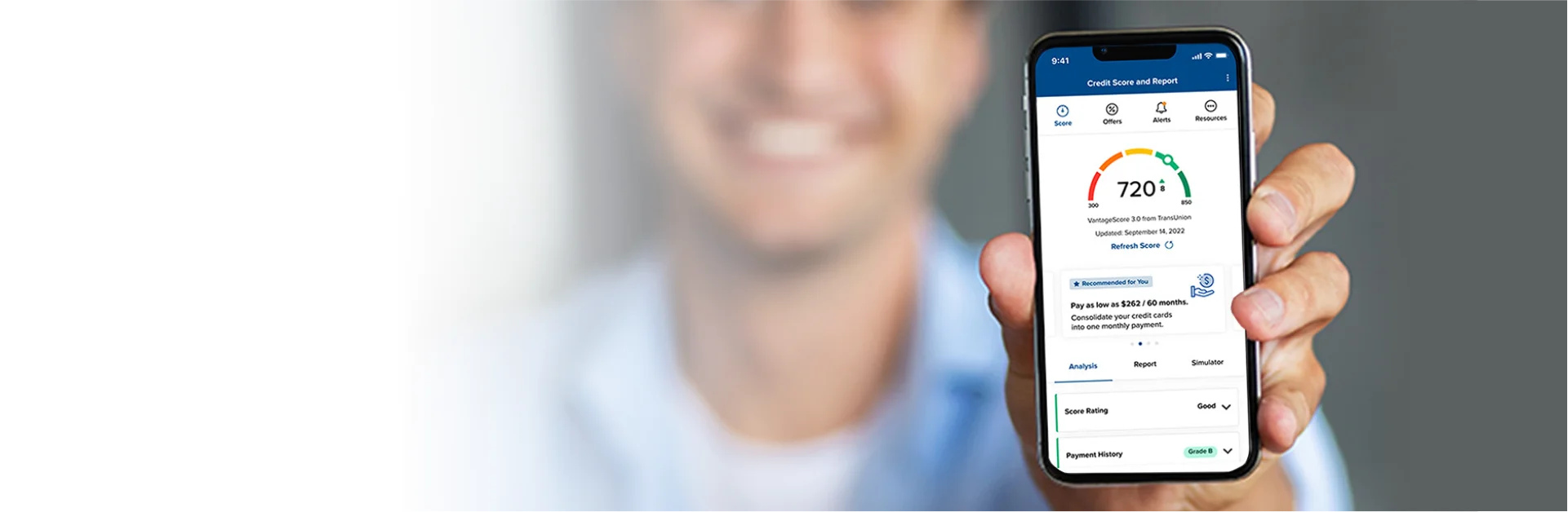 Man holding mobile device that displays credit score reporting within CNB digital banking