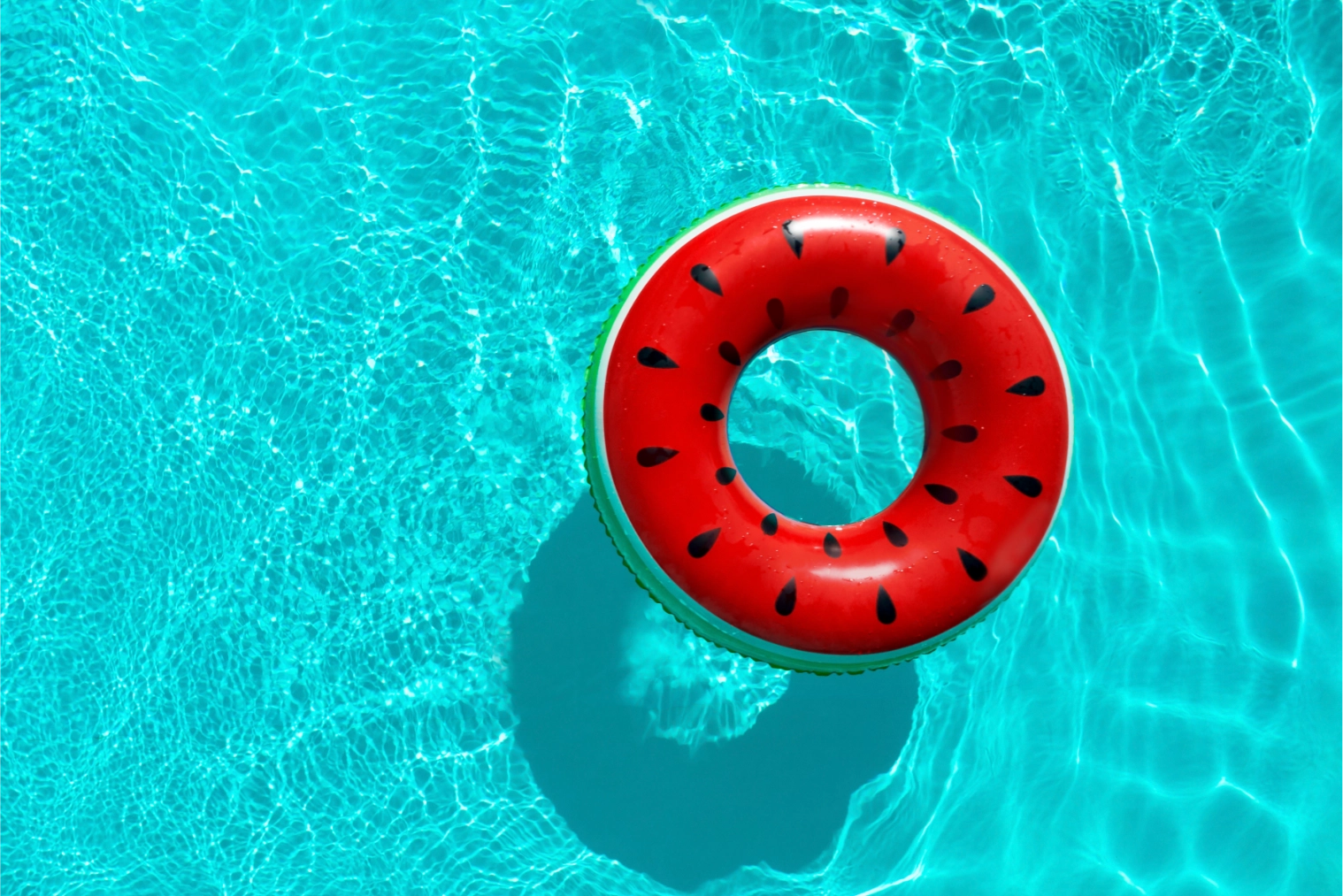 Pool float with watermelon design floating in water