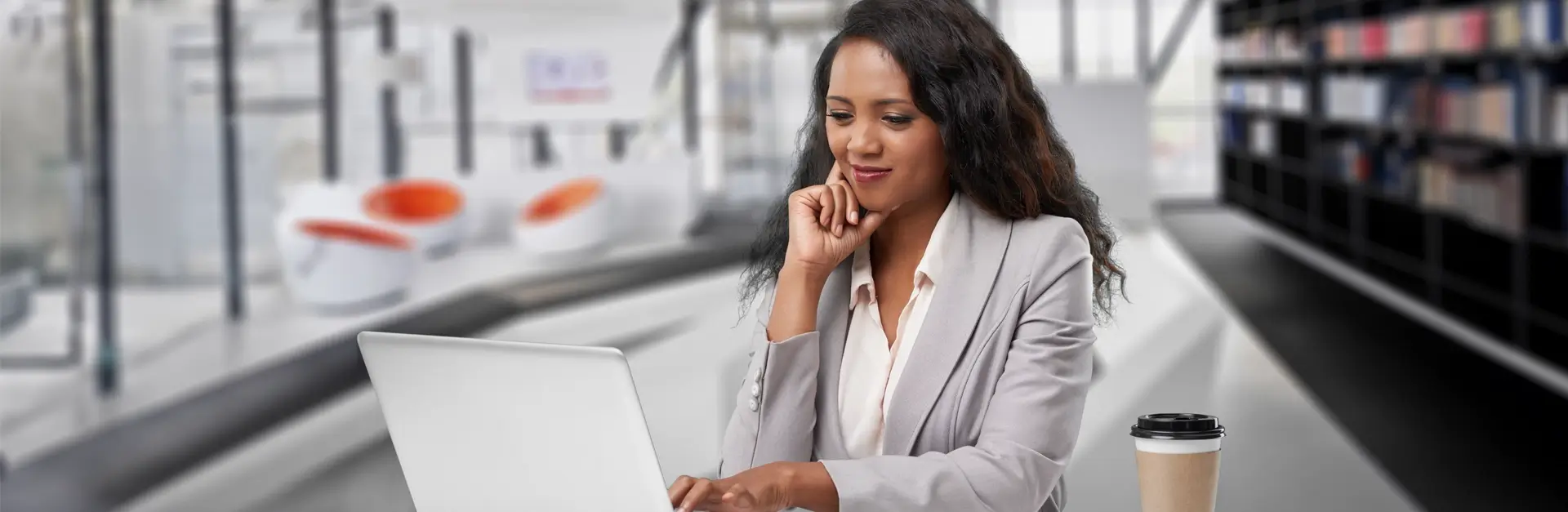 Woman in business clothing looking at computer
